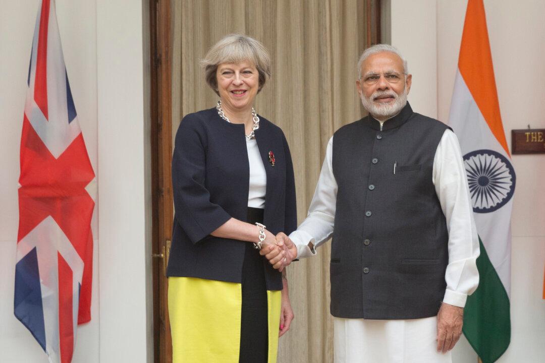 India, Britain Talk Trade and Investment During May’s Visit