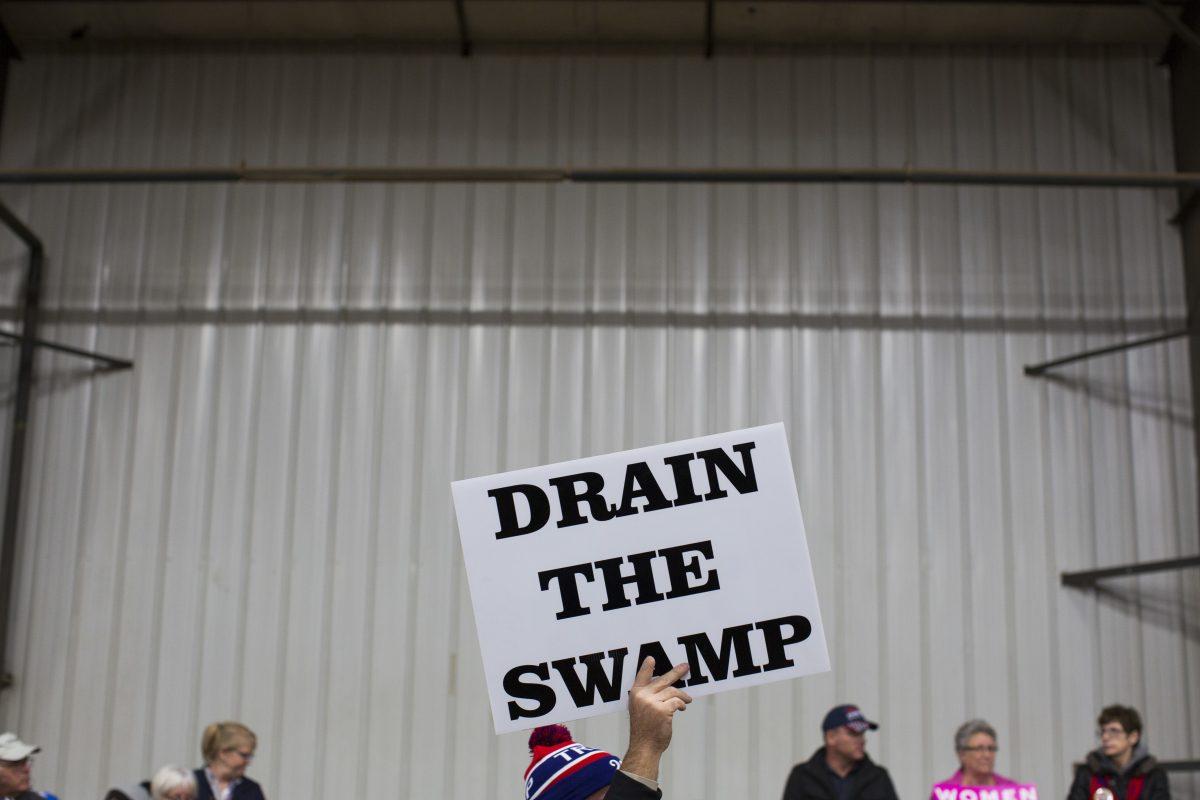 Supporters of then-Republican presidential candidate Donald Trump hold signs during a campaign rally in Springfield, Ohio, in this file photo. (AP Photo/ Evan Vucci)