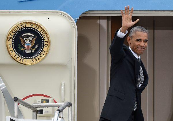 President Barack Obama waves as he departs from Tegel airport in Berlin on Nov. 18, 2016. (Rainer Jensen/dpa via AP)