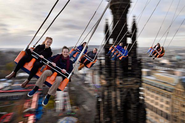 Members of the public enjoy a ride on the Star Flyer in Edinburgh, Scotland, on Nov. 28. (Jeff J Mitchell/Getty Images)