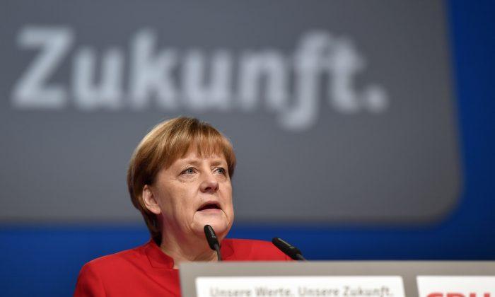 Germany’s Merkel Seeks New Party Term Amid Migrant Concerns
