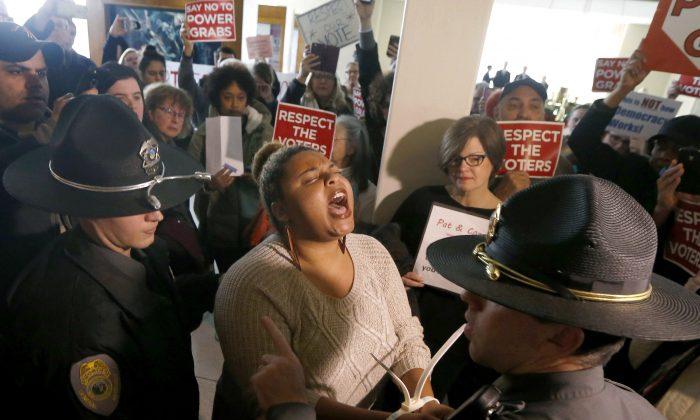 Protesters Rip GOP for Taking Away Next Governor’s ‘Power’