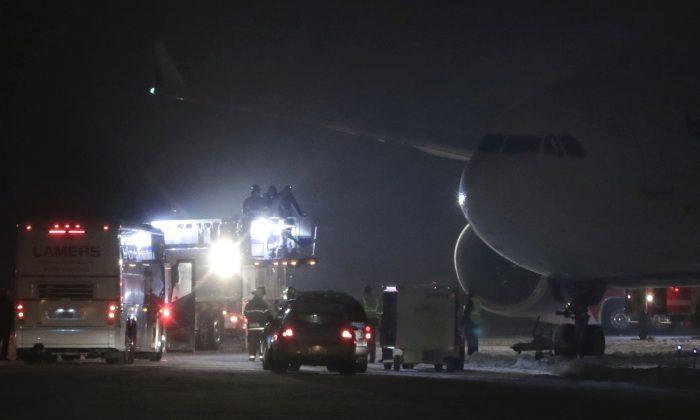 Minnesota Vikings’ Plane Slides Off Wisconsin Runway, Stuck for Hours