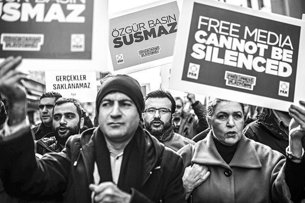Journalists shout slogans and hold placards during a march marking Journalism Day on Istiklal avenue in Istanbul as they protest against the imprisonment of journalists, on Jan. 10, 2016. (Ozan Kose/AFP/Getty Images)