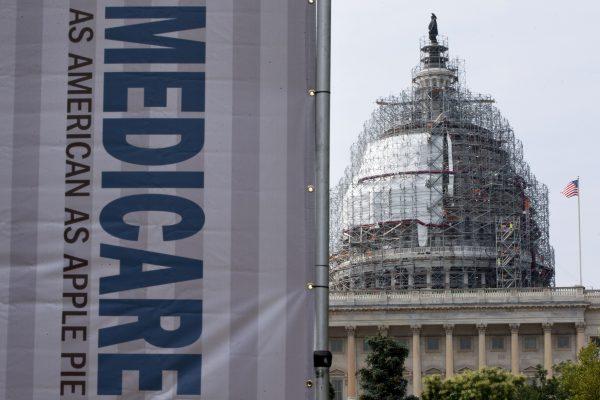 In this file photo, a sign supporting Medicare is seen on Capitol Hill in Washington, on July 30, 2015. (AP Photo/Jacquelyn Martin)
