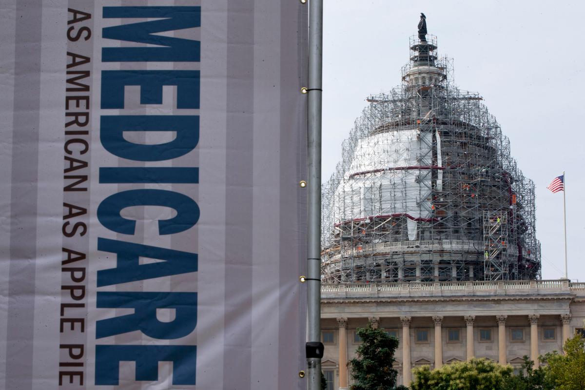 In this file photo, a sign supporting Medicare is seen on Capitol Hill in Washington. (AP Photo/Jacquelyn Martin)