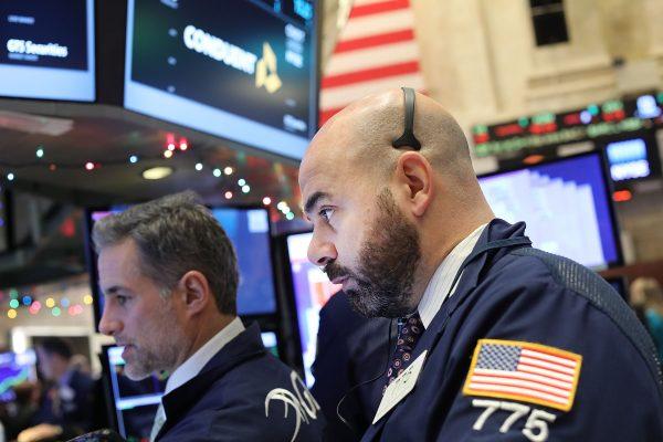 Traders work on the floor of the New York Stock Exchange on Jan. 3, the first trading day of 2017. Analysts see another year of gains for the S&P 500. (Spencer Platt/Getty Images)