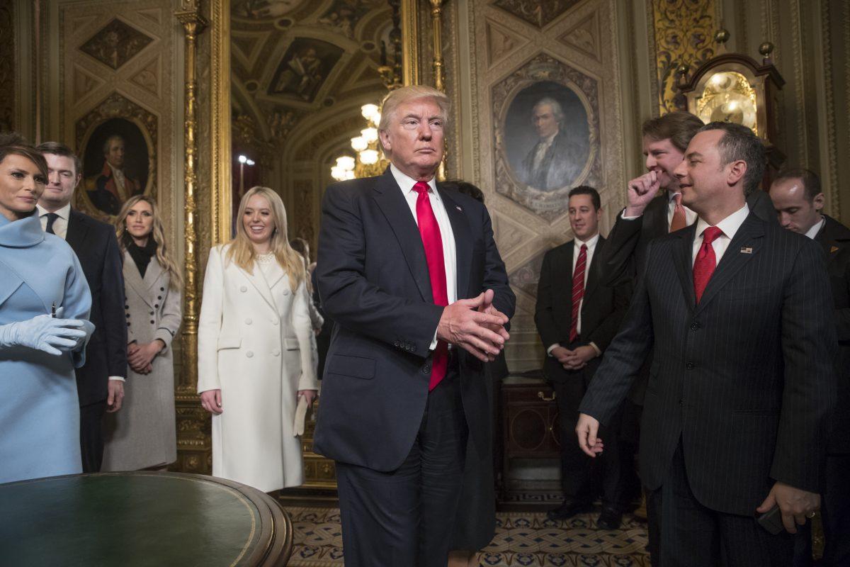 Then-President Donald Trump is seen after he formally signed his cabinet nominations into law, with advisers including White House counsel Don McGahn, leaving the President's Room of the Senate on Capitol Hill in Washington, D.C., on Jan. 20, 2017. (J. Scott Applewhite/Pool/AP Photo)