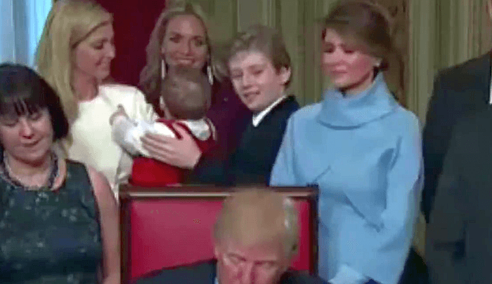 Barron Trump Plays ‘Peek-a-Boo’ With Nephew as Father Signs Executive Orders