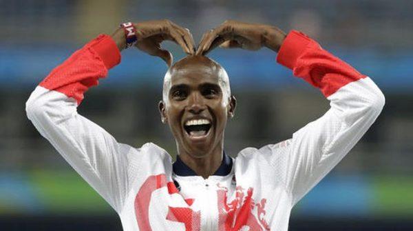 Britain's Mo Farah gesturing on the podium as he waits to receive his gold medal for the men's 5,000-metre race at the Olympic Games in Rio de Janeiro on Aug. 20, 2016. (Jae C. Hong/AP)