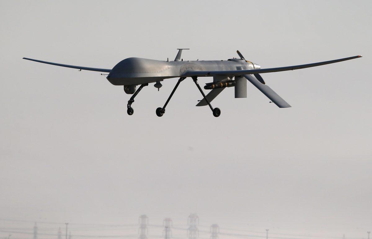 A U.S. Air Force MQ-1B Predator unmanned aerial vehicle (UAV), carrying a Hellfire missile lands at a secret air base after flying a mission in the Persian Gulf region on Jan. 7, 2016. (John Moore/Getty Images)