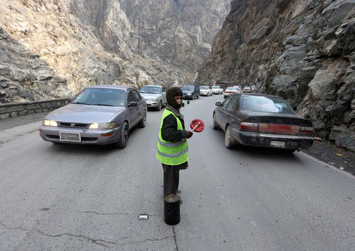 Afghan Children Direct Traffic on Mountain Pass for $4 a Day