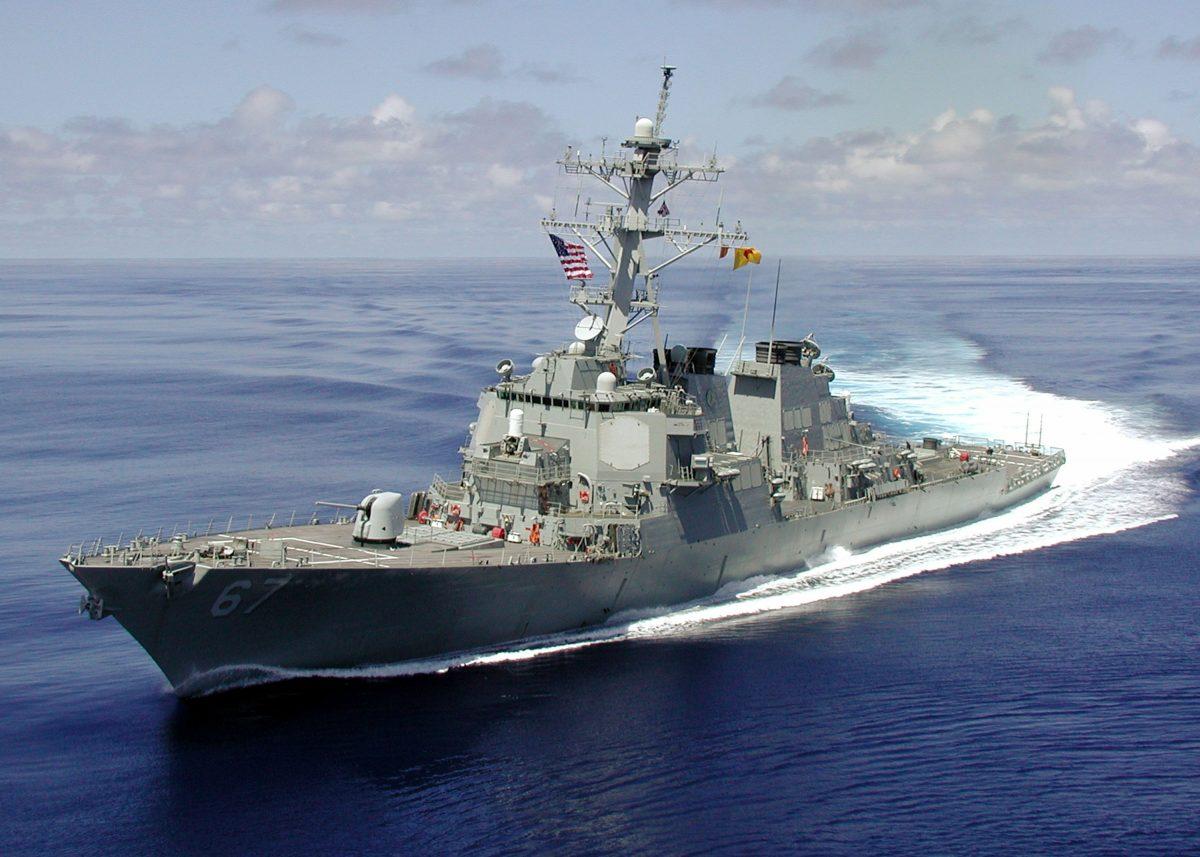 The Arleigh Burke class guided missile destroyer U.S.S. Cole is shown at sea approximately one month before being attacked by a terrorist-suicide mission which killed 17 U.S. sailors and injured approximately 36 others during a refueling operation in the port of Aden, Yemen, on Oct. 12, 2000. (Courtesy of U.S. Navy/Getty Images)