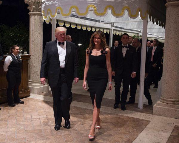 US President-elect Donald Trump arrives with his wife Melania for a New Year's Eve party at Mar-a-Lago in Palm Beach, Fla., on Dec. 31, 2016. (Don Emmert/AFP/Getty Images)