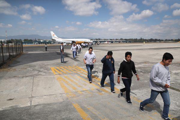 Guatemalan immigrants deported from the United States arrive on an ICE deportation flight in Guatemala City on Feb. 9, 2017. (John Moore/Getty Images)