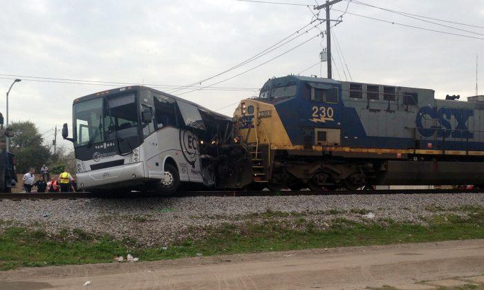 Train hits bus, killing 4 passengers on senior center trip