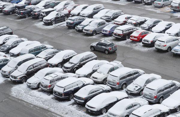 Cars are covered in snow in a general parking lot during the snowstorm at O'Hare International Airport in Chicago, Illinois, on March 13, 2017. (Kamil Krzaczynski/Reuters)