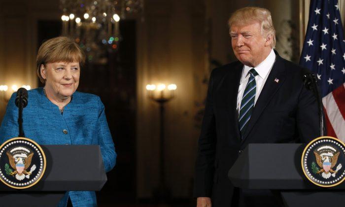 Trump Reiterates NATO Support, Presses Merkel on Spending Targets