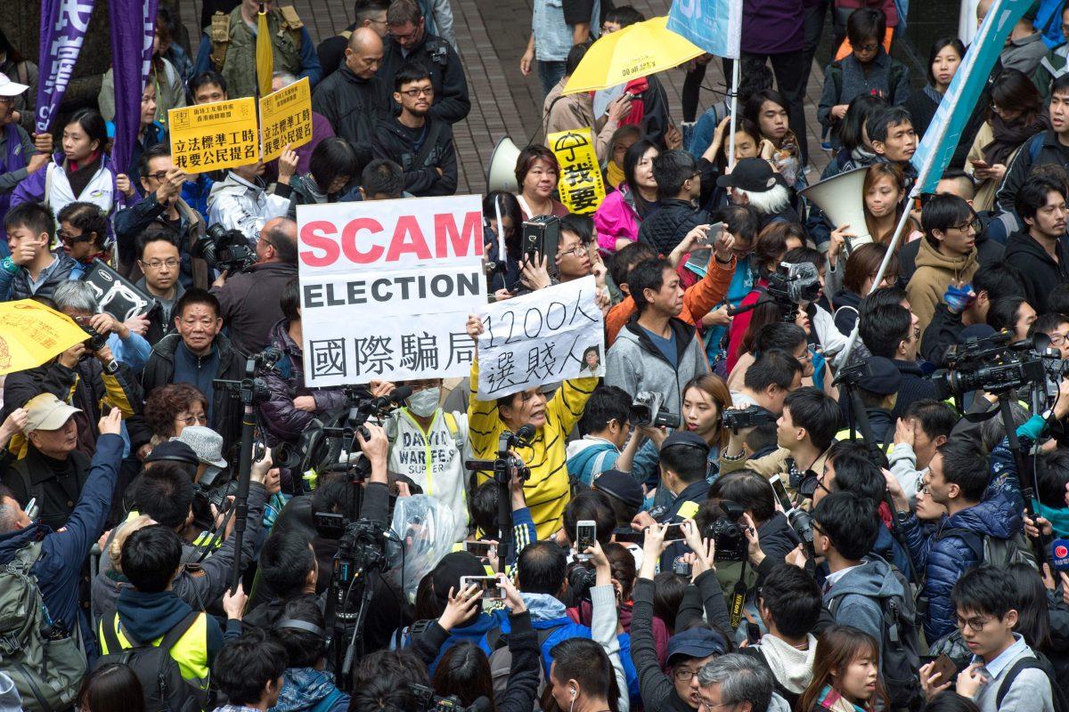 Pro-democracy activists protest outside the venue of the Hong Kong chief executive election in Hong Kong on March 26, 2017. (Jayne Russell/AFP/Getty Images)