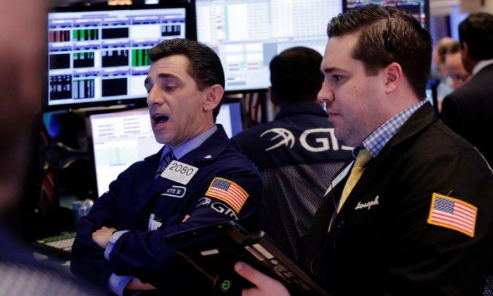Stocks Rise, Dollar Rallies After Strong US Data