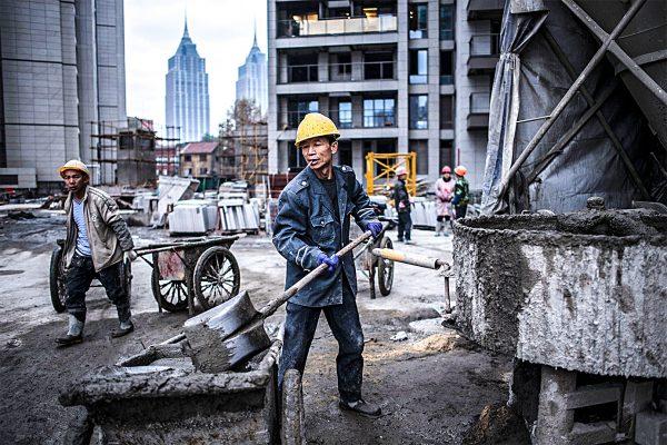 Construction workers at a residential skyscraper in Shanghai on Nov. 29, 2016. (Johannes Eisele/AFP/Getty Images)