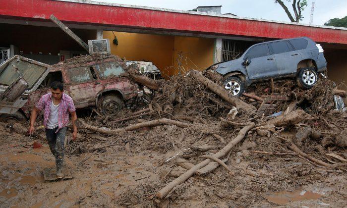 Frantic Rescuers Dig for Colombia Flood Victims, 254 Dead