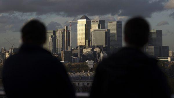 Late afternoon sunshine falls on the financial district in East London in 2014. Some areas of East London have seen a rash of gang-related acid attacks carried out by men against other men. (Andrew Cowie/AFP/Getty Images