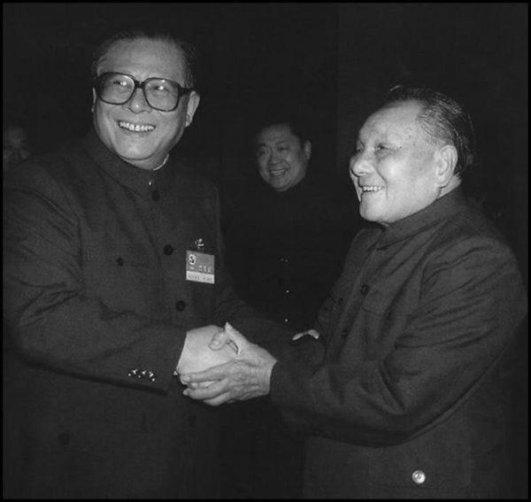 Former Chinese Communist Party leader Deng Xiaoping (R) and his successor Jiang Zemin shake hands in October 1992. (AFP/Getty Images)