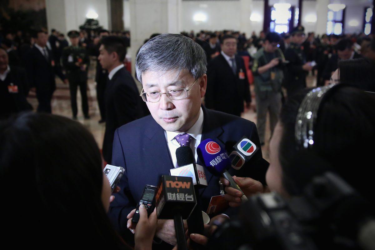 Guo Shuqing, Chairman of the China Banking Regulatory Commission, answers media questions in Beijing on March 8, 2015, then as head of the country's securities regulator. (Feng Li/Getty Images)