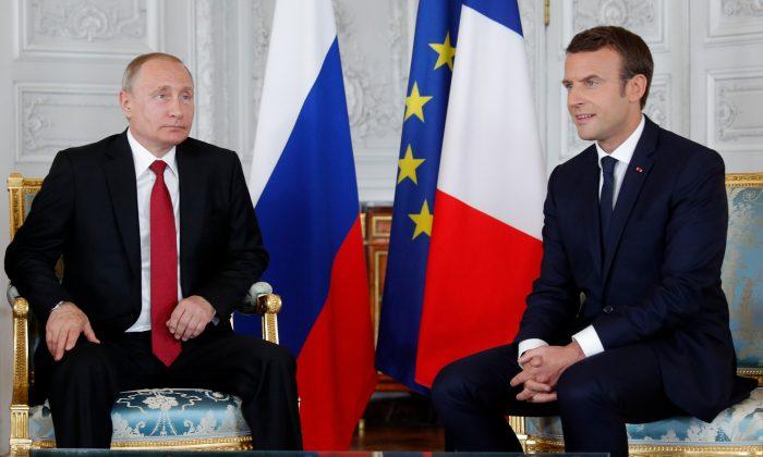 Macron Meets Russia’s Putin Near Paris, Promising Tough Talks