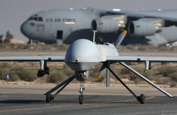 A U.S. Air Force MQ-1B Predator unmanned aerial vehicle (UAV), carrying a Hellfire air-to-surface missile lands at a secret air base in the Persian Gulf region on Jan. 7, 2016. (John Moore/Getty Images)