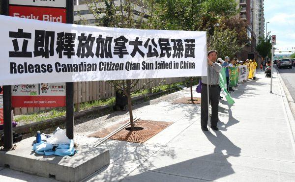 Falun Gong adherents gather in front of the Chinese Consulate in Calgary to appeal for the release of Canadian citizen Sun Qian, who has been detained in China since Feb. 19, 2017, for her faith in Falun Gong. (The Epoch Times)