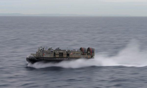 A U.S. Navy Landing Craft Air Cushion (LCAC) heads across the Pacific Ocean toward Sydney, Australia, during events marking the start of Talisman Saber 2017—a biennial joint military exercise between the United States and Australia—on July 29, 2017. (Jason Reed/Reuters)