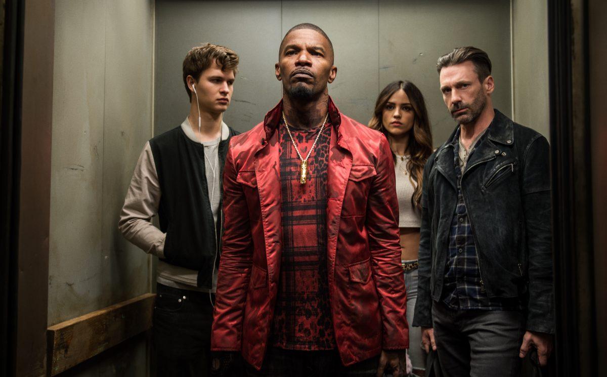 (L–R) Baby (Ansel Elgort), Bats (Jamie Foxx), Darling (Eiza González), and Buddy (Jon Hamm) decide on doing the heist in TriStar Pictures's "Baby Driver." (Sony Pictures Entertainment Inc.)