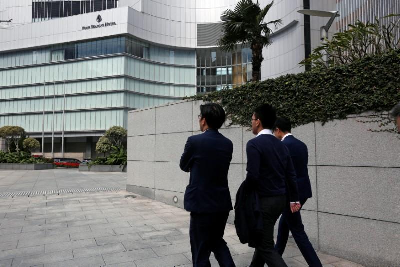 People pass by the entrance to Four Seasons Hotel, where Chinese billionaire Xiao Jianhua was last seen on Jan. 27, in Hong Kong, China, on Feb. 1, 2017. (Bobby Yip/Reuters)