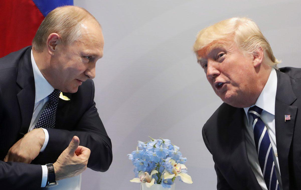 President Donald Trump and Russia's President Vladimir Putin speak during their meeting on the sidelines of the G20 Summit in Hamburg, Germany, on July 7, 2017. (Mikhail Klimentiev/AFP/Getty Images)