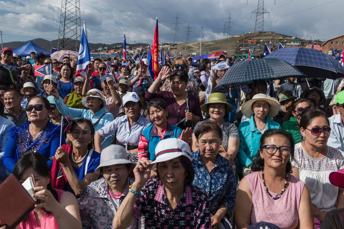 Mongolian supporters listen to the speech of Mongolian presidential election candidate Battulga Khaltmaa from the Mongolian Democracy Party during a rally in Ulan Bator on June 23, 2017. (Fred Dufour/AFP/Getty Images)