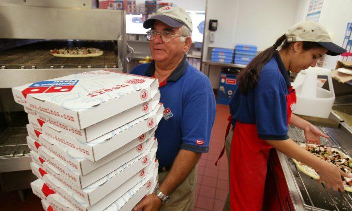 Domino’s Paying Customers to Pick up Their Own Pizza Until May