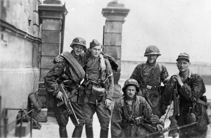 Members of the Armia Krojowa (Home Army) pose for a photo on Aug. 11, 1944, during the Warsaw Uprising. (Juliusz Bogdan Deczkowski/Public Domain)