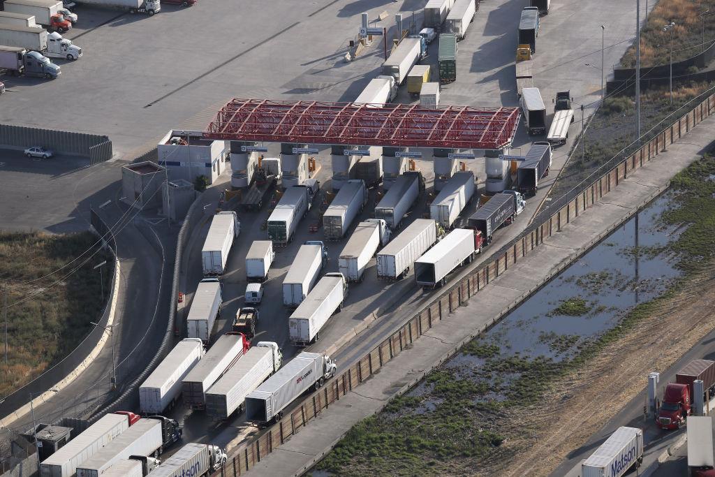 Freight trucks, as seen from a helicopter, pass through Mexican Customs before entering the United States at the Otay Mesa port of entry in San Diego, Calif., on May 11, 2017. (John Moore/Getty Images)