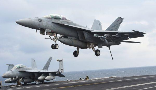 A two-seater F/A-18F Super Hornet landing on the deck of the Nimitz-class aircraft carrier USS Carl Vinson during military drills on March 14, 2017. (JUNG YEON-JE/AFP/Getty Images)