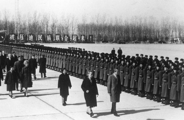 U.S. President Richard Nixon inspecting a guard of honor with Chinese leader Chou En Lai, at Beijing airport, on Feb. 21, 1972. (Keystone/Getty Images)