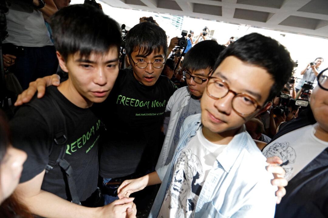 Hong Kong Democracy Leader Defiant as Three Jailed for Months
