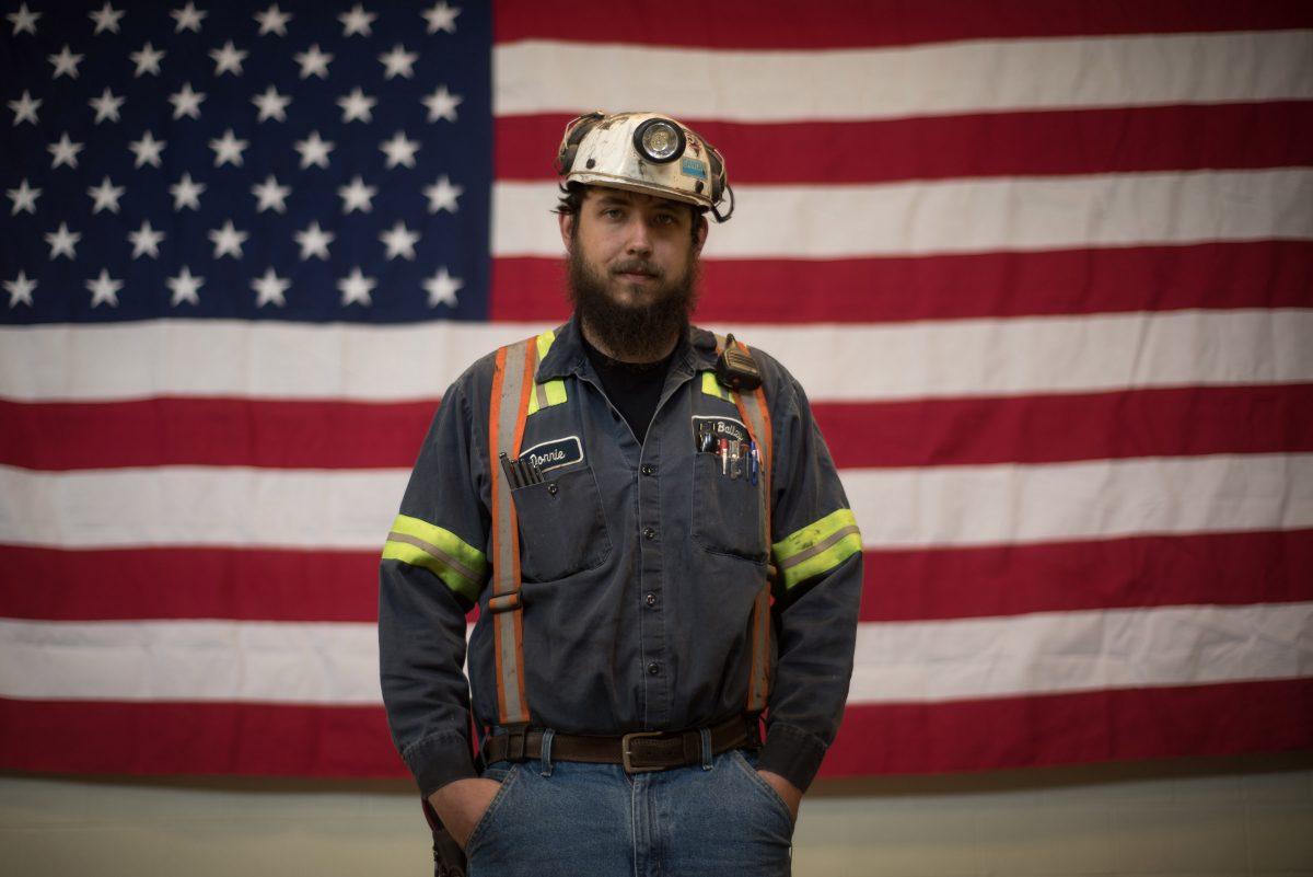 Donnie Claycomb, 27, of Limestone, West Virginia., who has been mining for 6 years, stands in front of an American flag prior to an event with U.S. Environmental Protection Agency Administrator Scott Pruitt at the Harvey Mine in Sycamore, Pennsylvania, on April 13, 2017. (Justin Merriman/Getty Images)