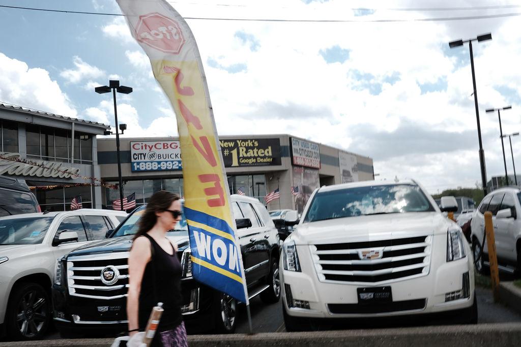 Cars sit in a lot at a Queens auto dealership in New York City. (Spencer Platt/Getty Images)