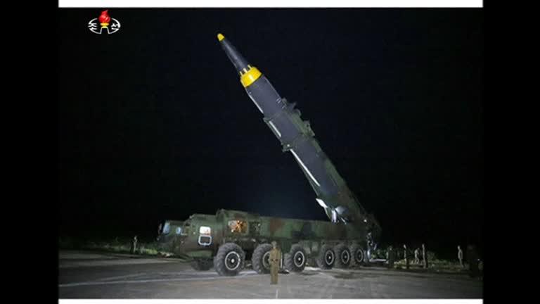 A North Korean intermediate-range ballistic missile Hwasong-12 is shown prior to launch from a vehicle. (screenshot)