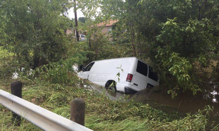 Houston Police Find Van That Was Swept Away With Family of 6