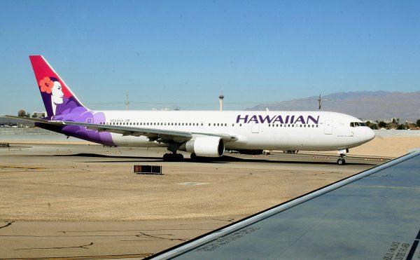 A Hawaiian Airlines jet taxies out to the runway at Phoenix Sky Harbor International Airport in Phoenix, Ariz., on Feb. 14, 2006. (Karen Bleier/AFP/Getty Images)
