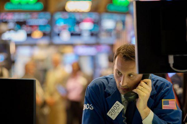 A trader works on the floor of the New York Stock Exchange at the closing bell of the Dow Jones Industrial Average in New York on June 8, 2017. (Bryan R. Smith/AFP/Getty Images)