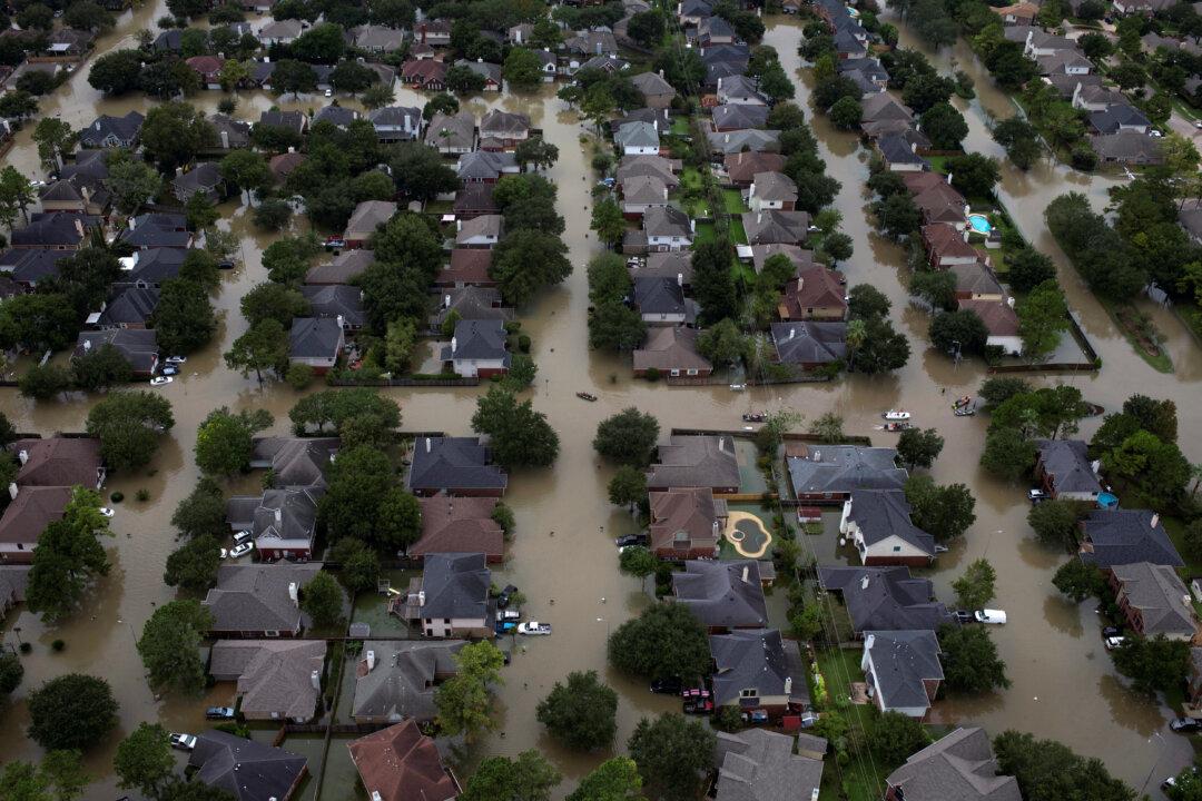 Monster Truck Style Cadillac Saves Military Vehicle Stuck in Texas Flood (Video)